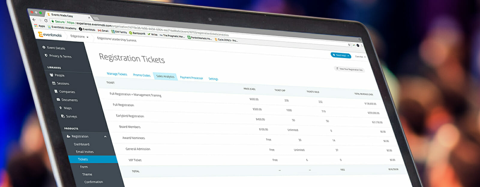 Laptop screen shows event data used to measure event ROI