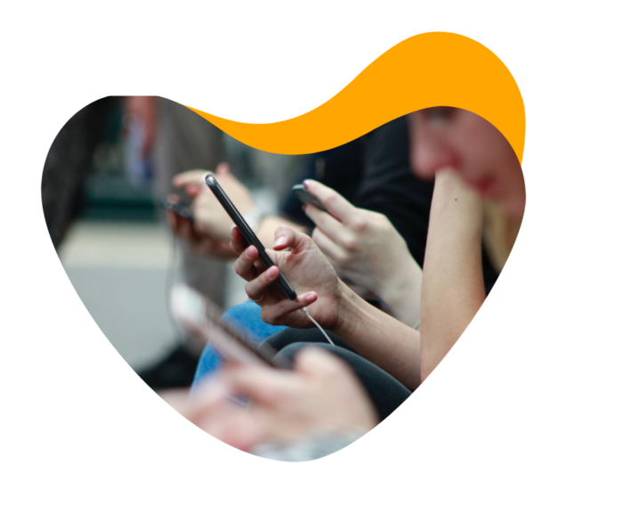 A group of attendees engage with event content using their mobile event apps