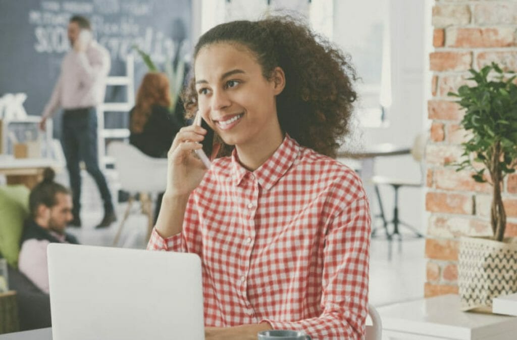 A young woman on the phone.