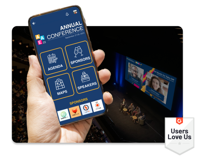 A hand holding a mobile phone that shows an in-person Annual Conference’s event homepage. A G2 badge showing that users love using EventMobi.