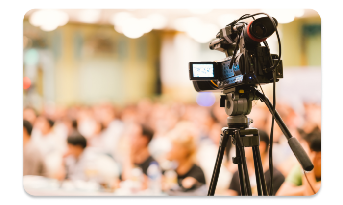 The speech of a conference speaker is recorded by a professional videographer