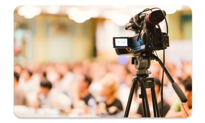 The speech of a conference speaker is recorded by a professional videographer