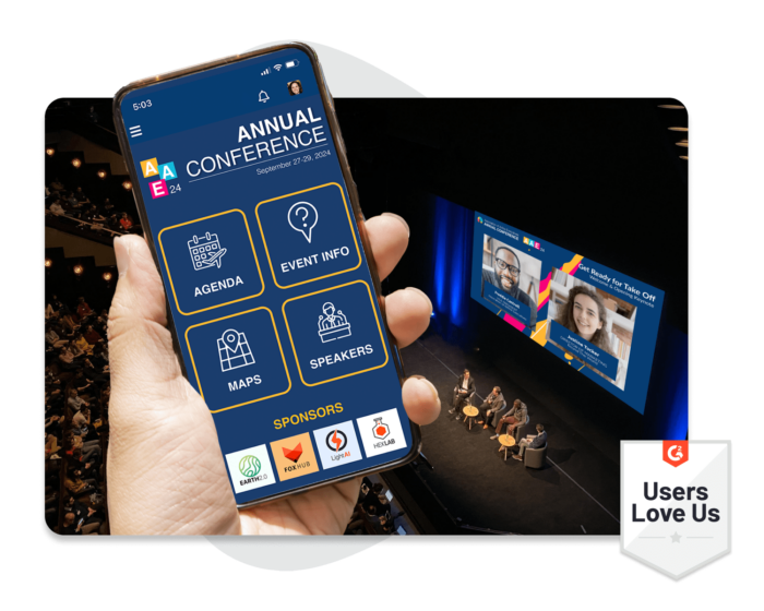 A hand holding a mobile phone that shows an in-person Annual Conference’s event homepage. A G2 badge showing that users love using EventMobi.