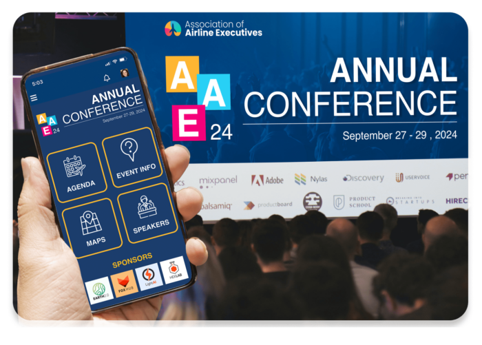 Mobile phone with event app held up with crowd viewing matching live display on conference screen