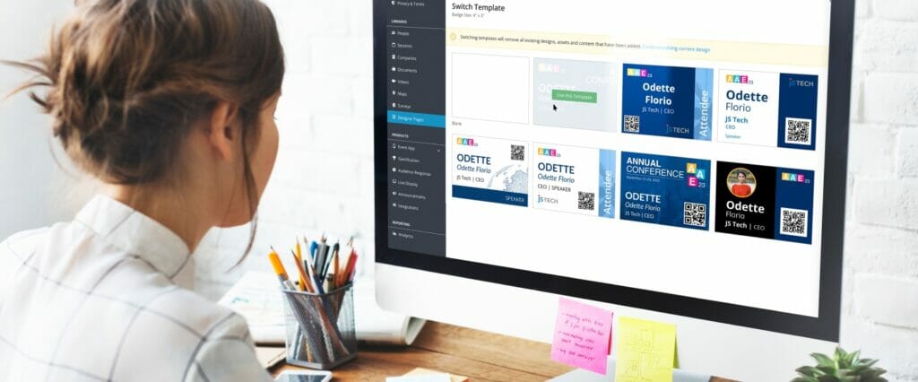 A person using EventMobi's Badge Designer to select a conference badge design.