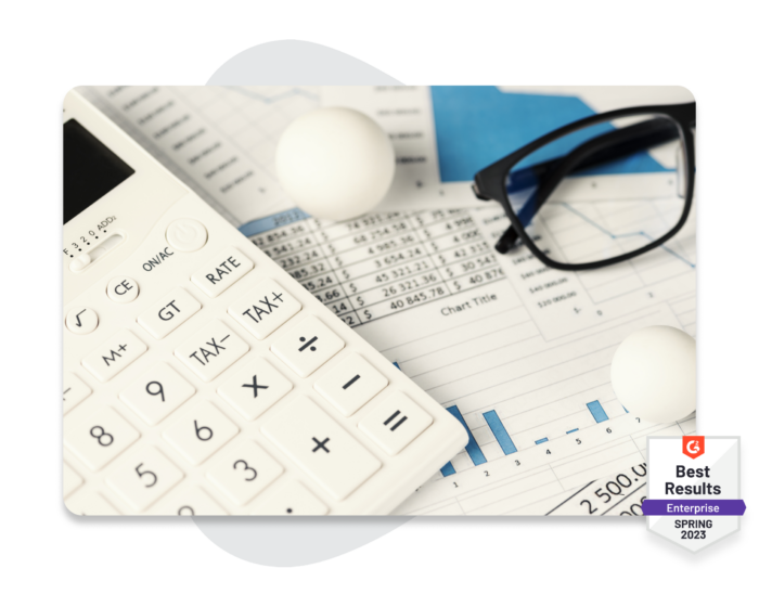Image: A calculator and paperwork overlaid with a badge from G2 that says "Best Results: Enterprise Spring 2023"