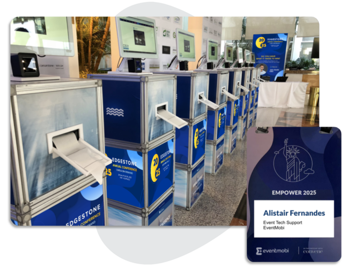 A row of EventMobi's Direct Thermal Badge Printing kiosks, in the lobby of a conference event.